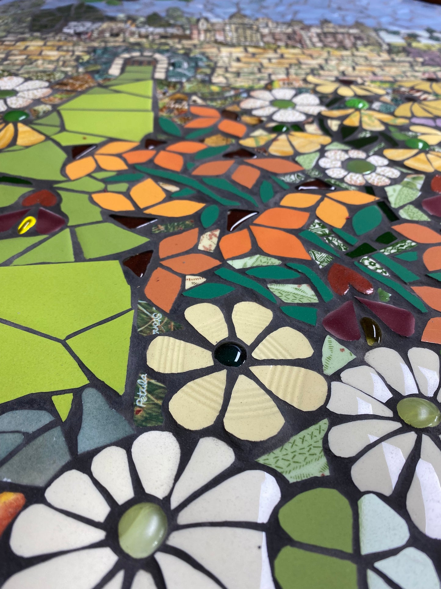 A colourful close up of a mosaic of Abbotsford House, showing the flowers