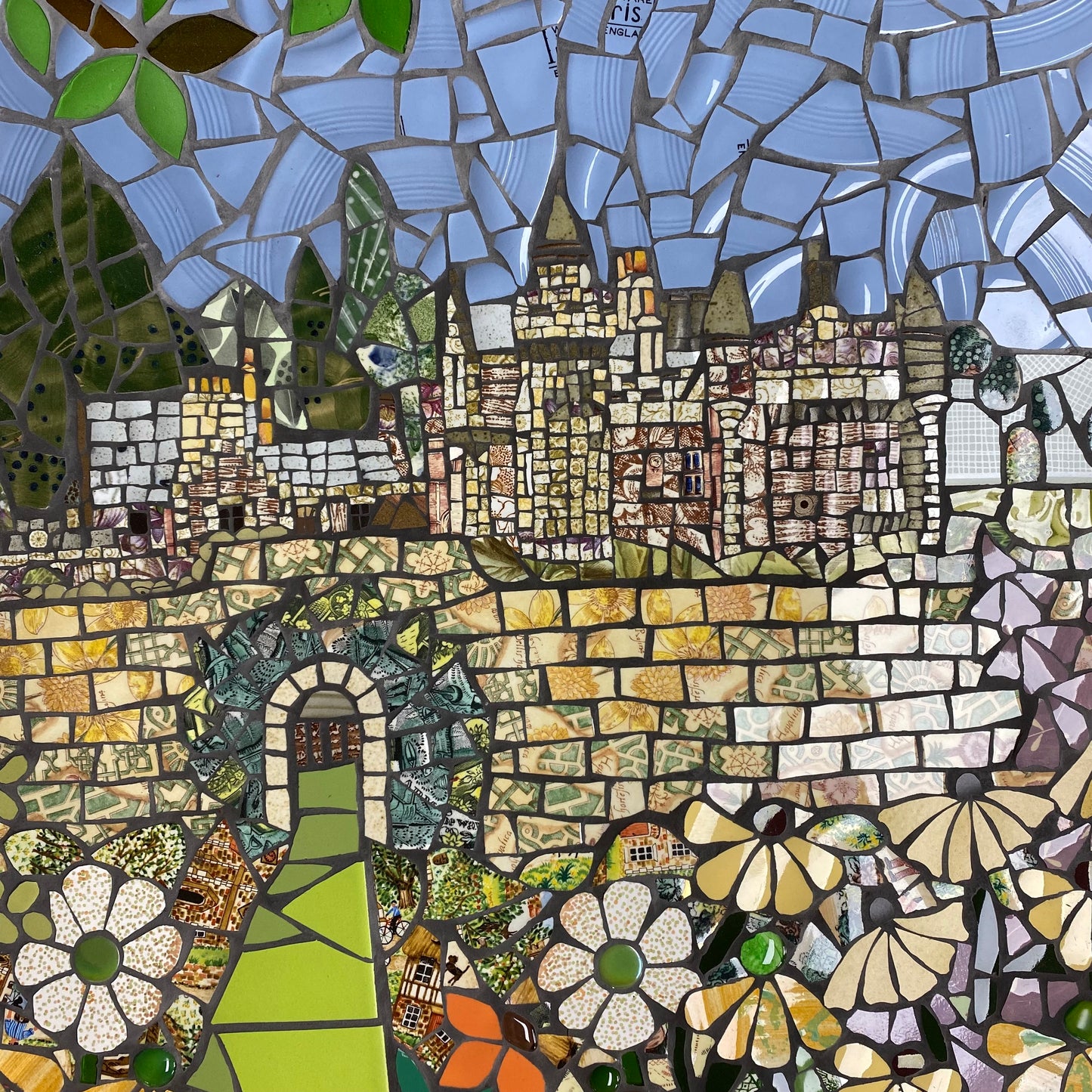 square image of Abbotsford House and garden depicted in mosaic using upcycled ceramics
