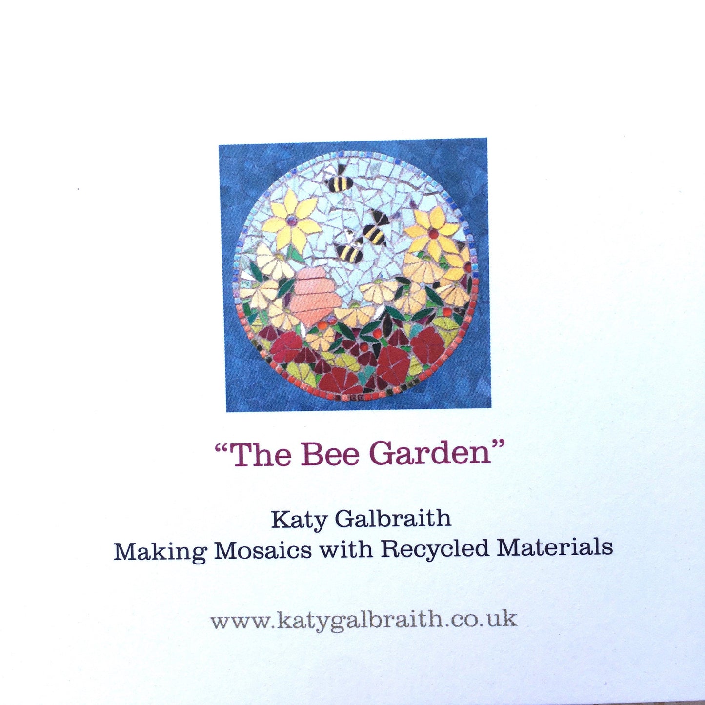 reverse of a a card, with white card, small image of the card design and the artist details - katy galbraith, making mosaics with recycled materials and website www.katygalbraith.co.uk on it.
