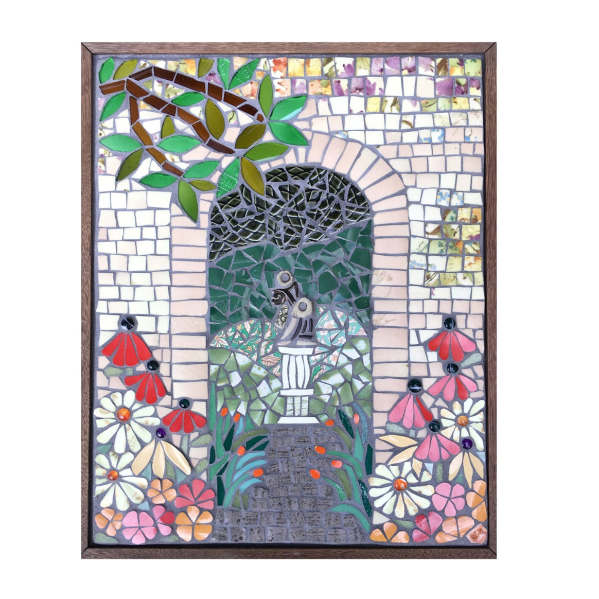 a mosaic of an archway with a branch and flowers, framed in wood, on a white background