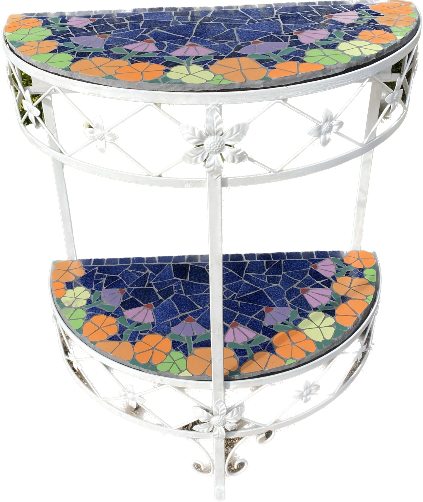 half moon patio table with mosaic surfaces. Two surfaces, with orange and lime green flowers edge the blue centre . The table is a metal vintage one and is showing as white, but has now been painted dark brown. Shown with a white background