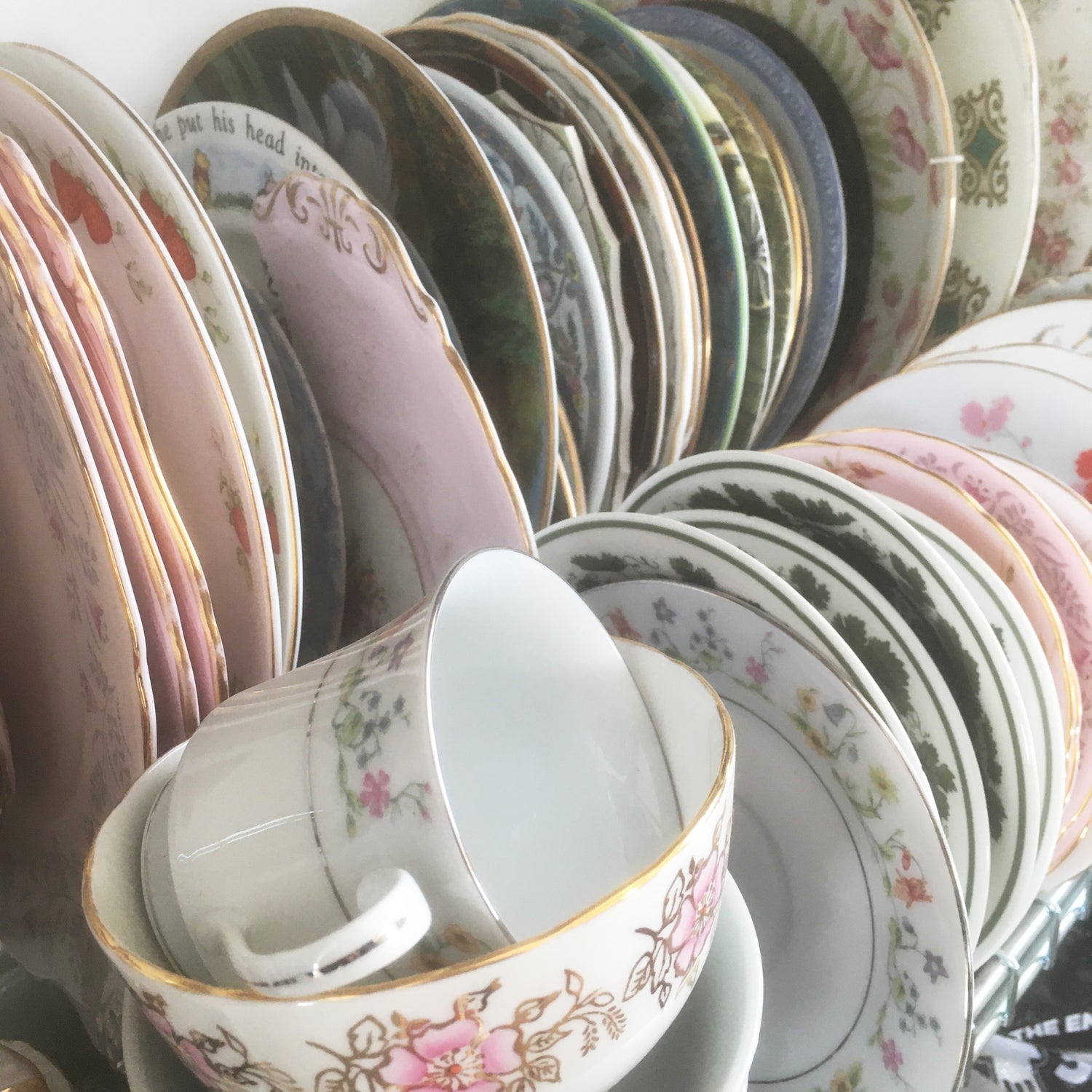 vintage bone china plates on a rack