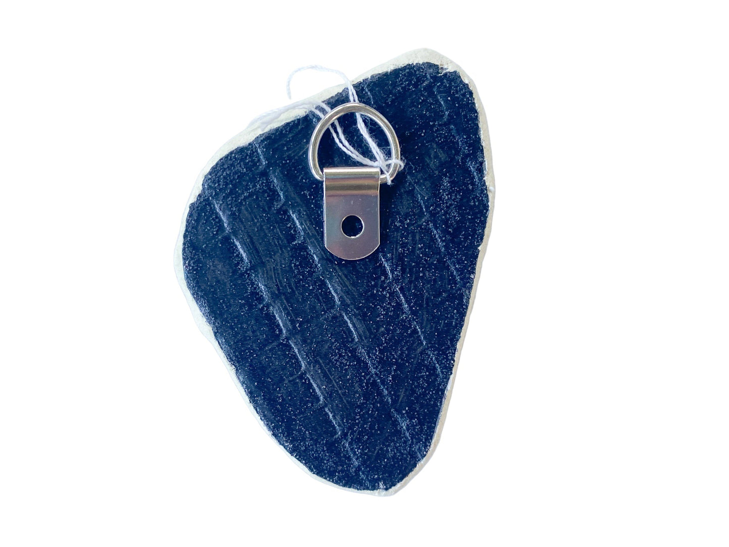 black painted reverse of mosaic with a meta D ring on a white background