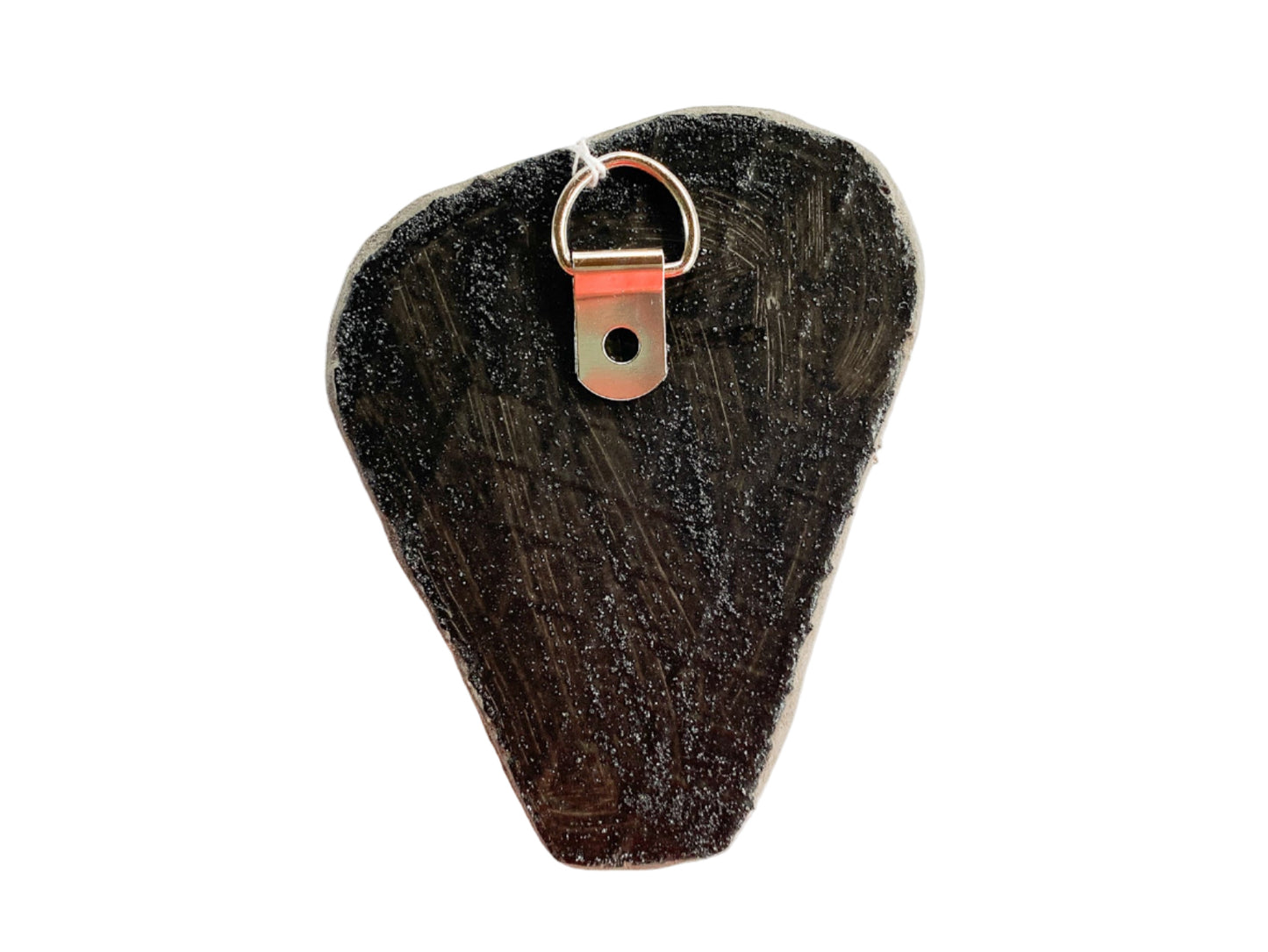 textured reverse side of mosaic with d-ring on a white background