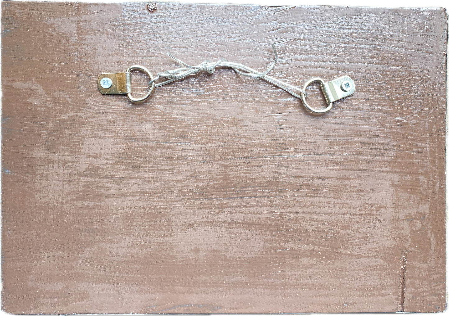 reverse of a mosaic, showing the painted ply background, with D ring fixings and hanging wire
