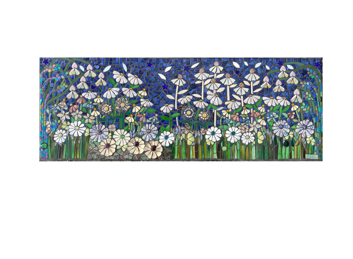 long rectangular panel of flowers in whites and creams mosaic, which deflect the light. Dark blue background