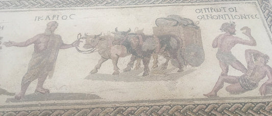 roman mosaic floor showing a man leading two cattle, and two men fighting