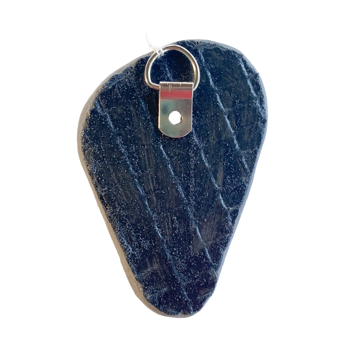 Black reverse side of a mosaic with a metal D-ring on a white background