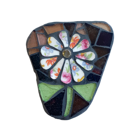 Mosaic art piece with a chintz flower design on a white background