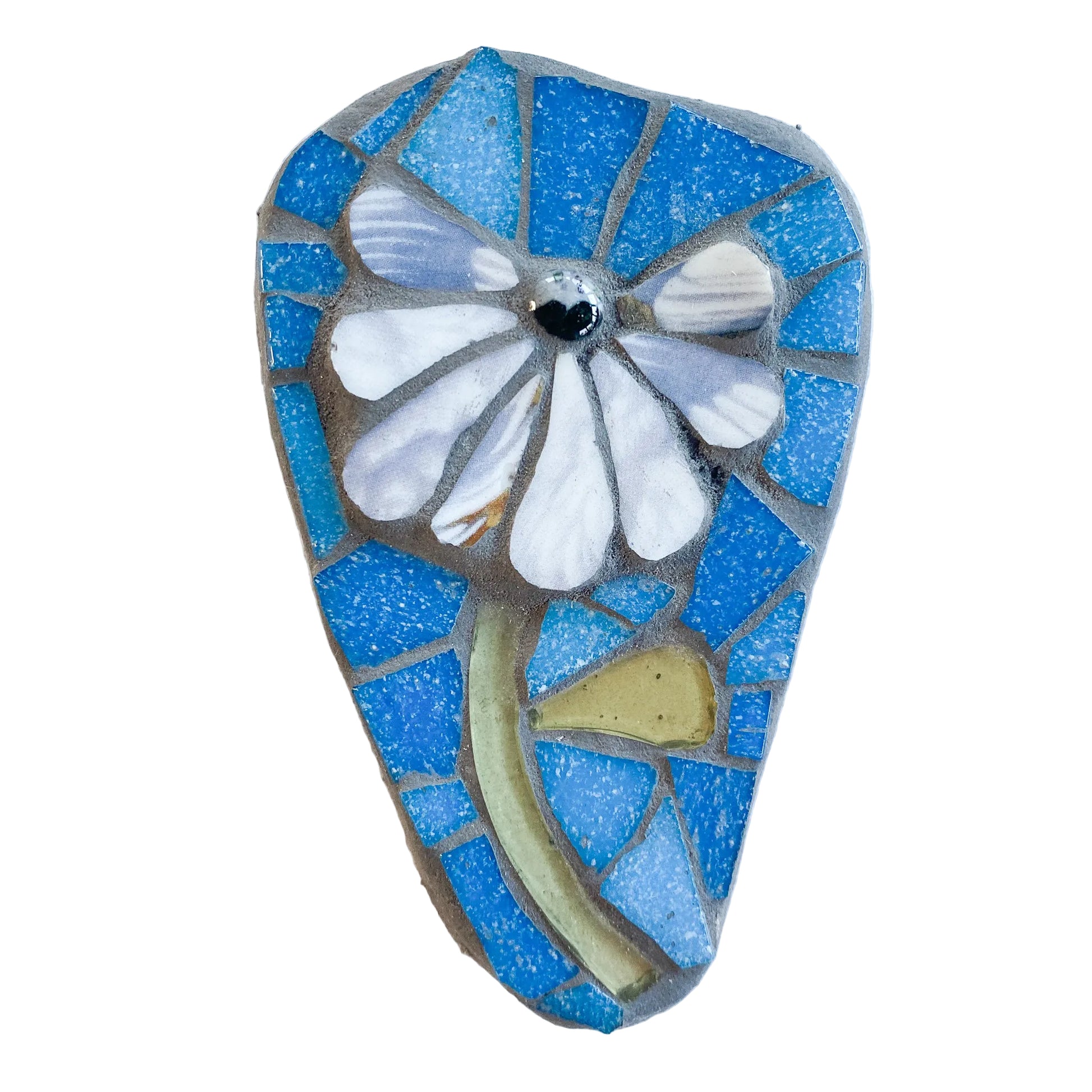 Mosaic art piece with a white flower design on a blue background