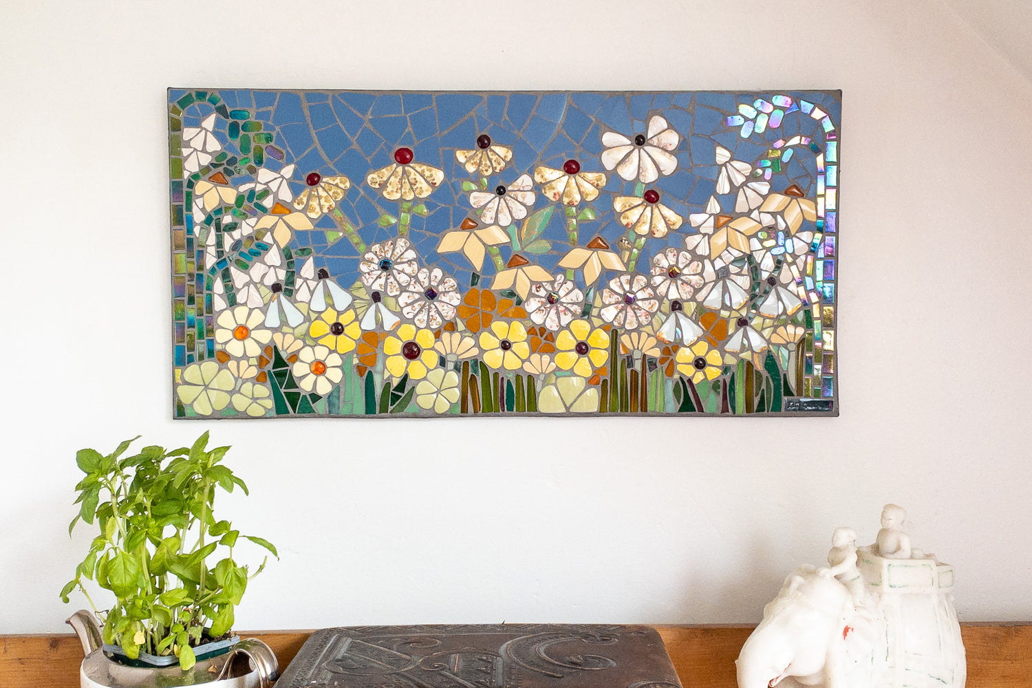 a long panel with flowers with shiny elements, depicted in mosaic