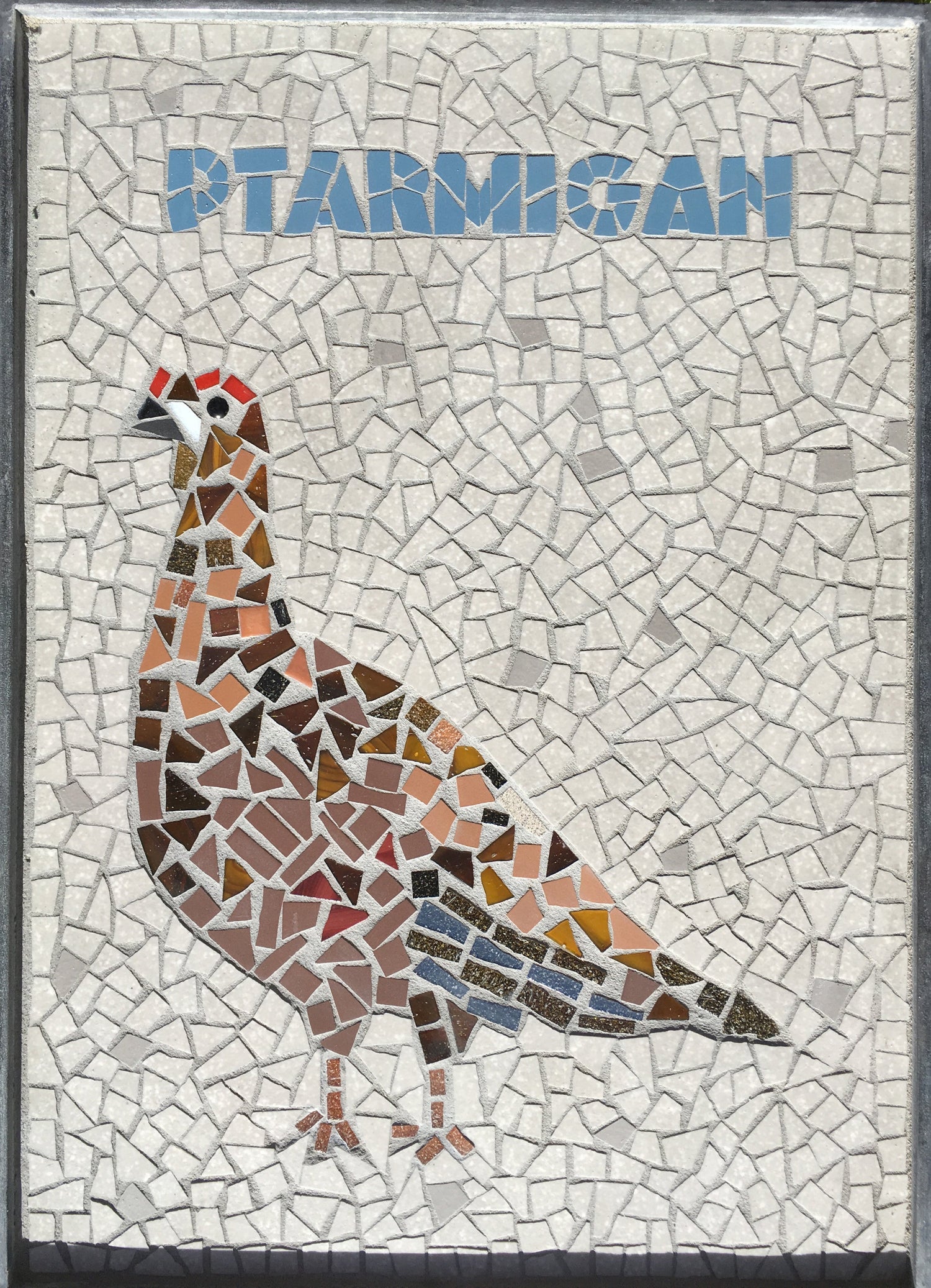 mosaic panel of a ptarmigan, with blue lettering