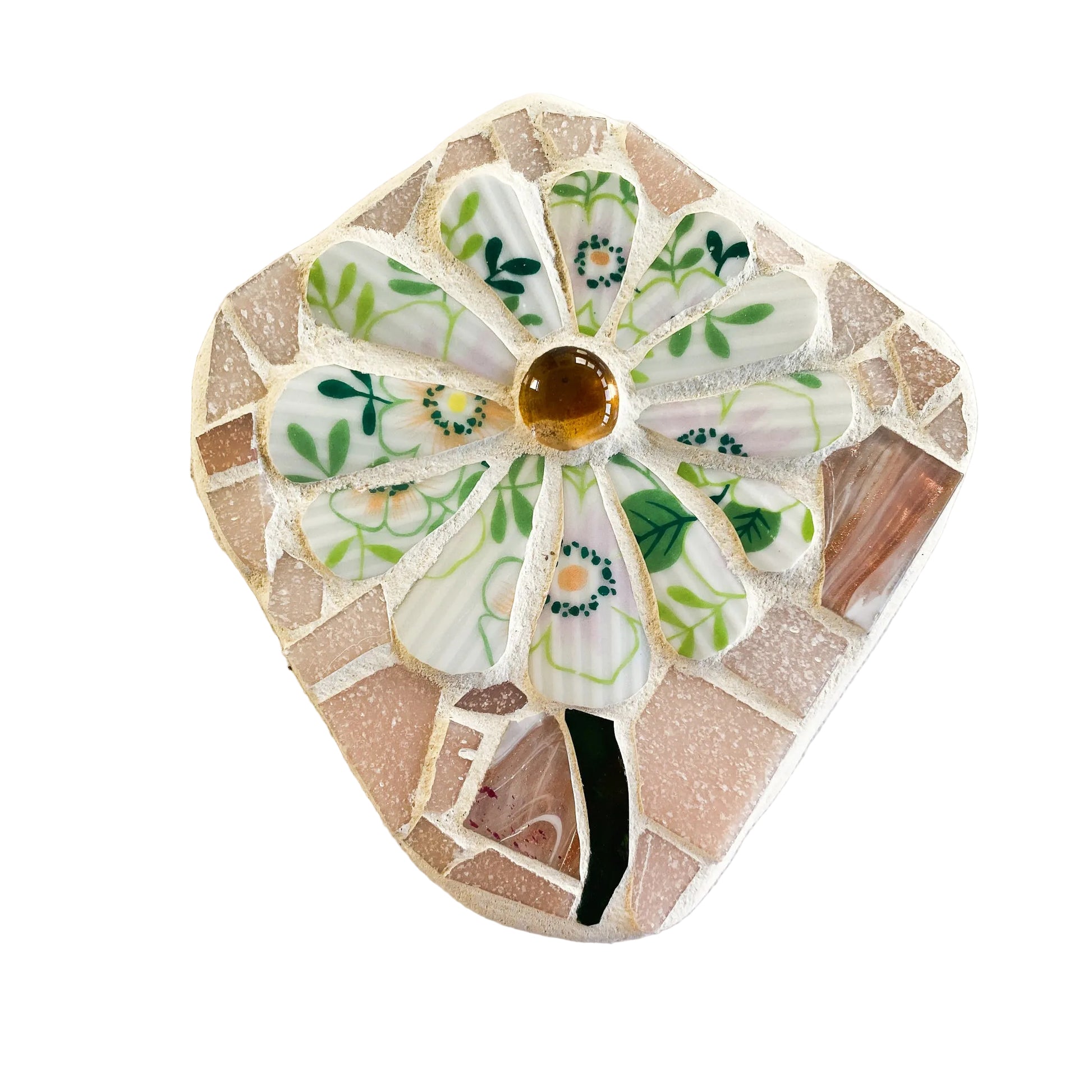 Decorative mosaic piece with floral design on a light background