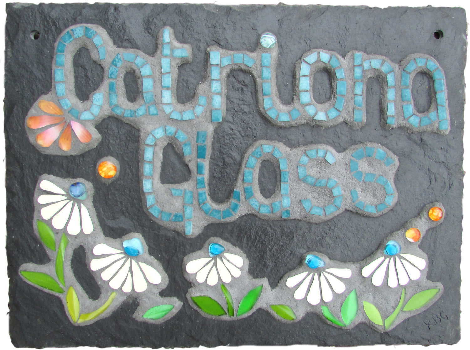 a sign saying Catriona Glass in turquoise with some white daisies, made in mosaic on slate