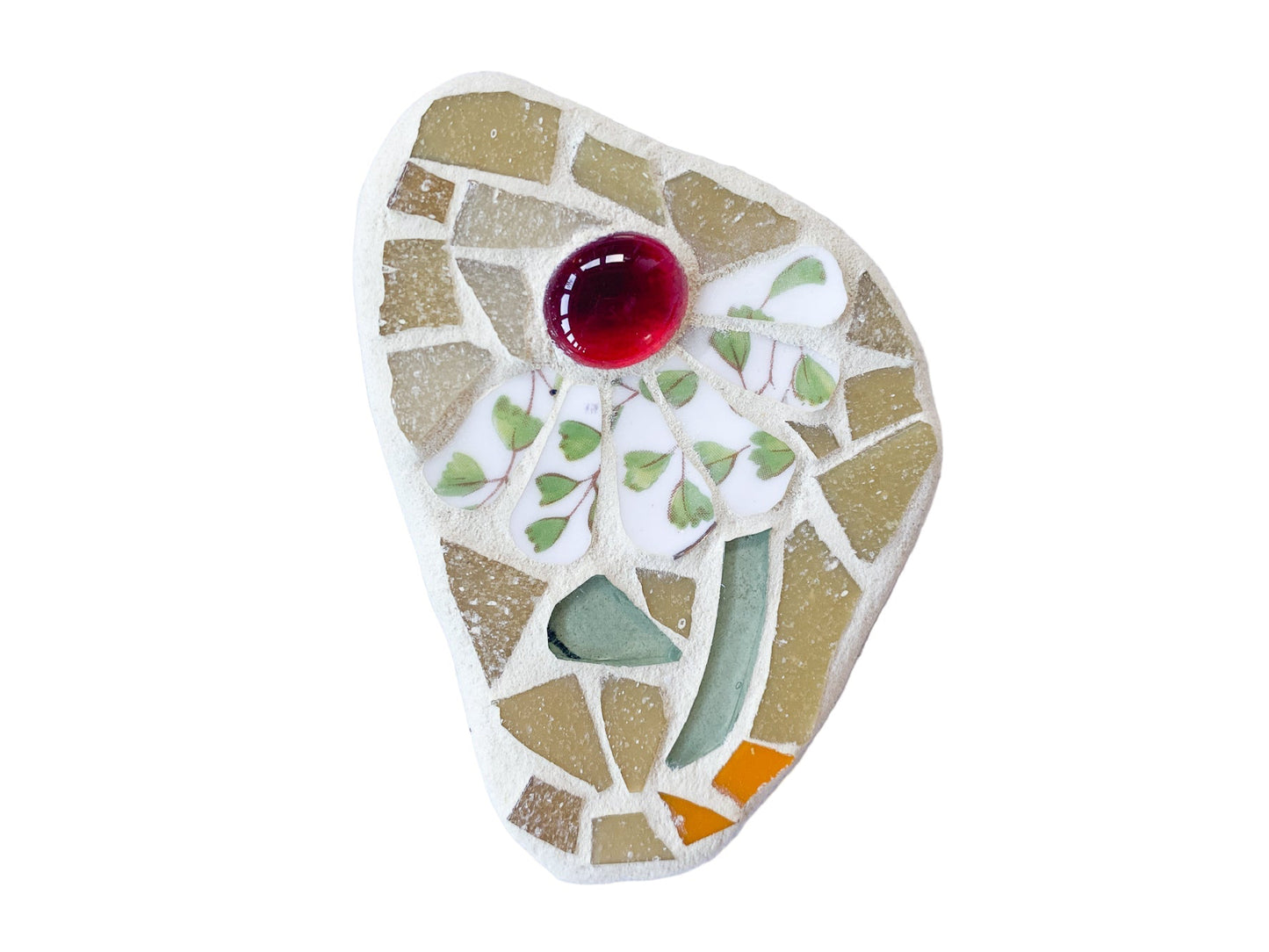 Mosaic art piece with a red center on a white background