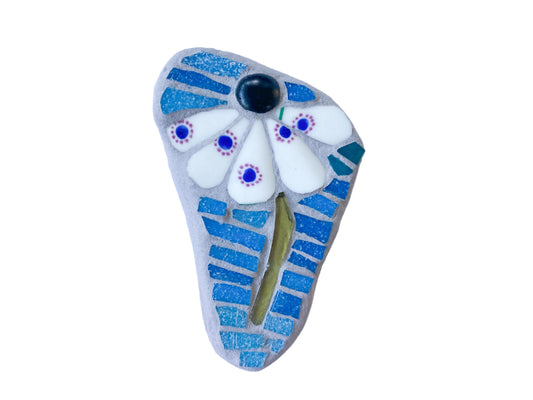 Decorative mosaic with blue and white floral design on a white background