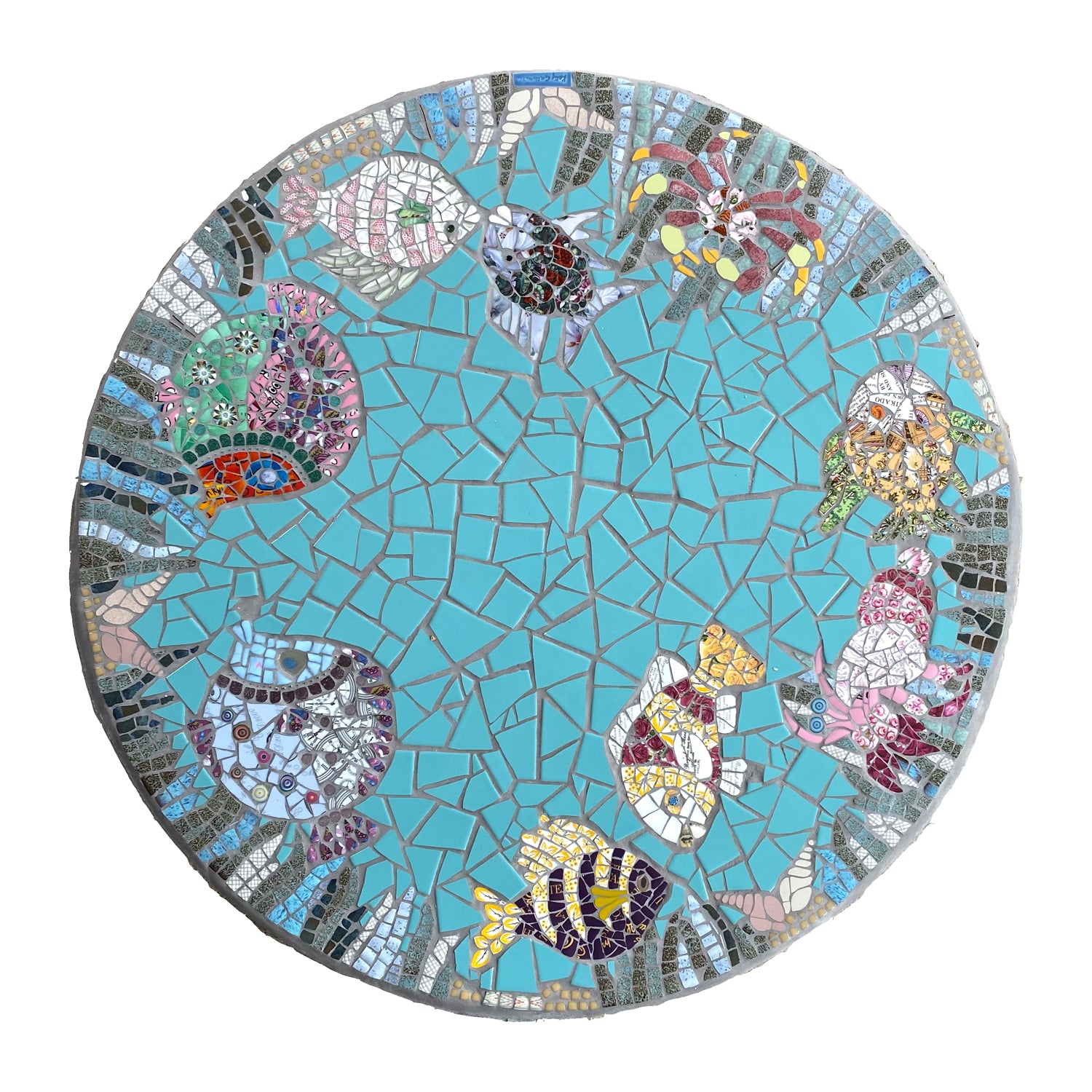 Circular turquoise tabletop in mosaic with fish and seaweed around the edge