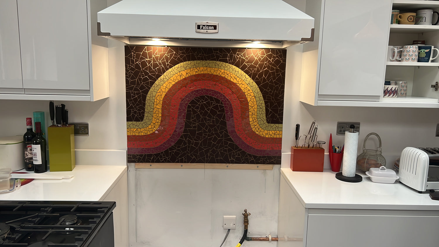 Mosaic rainbow in retro colours in a white kitchen